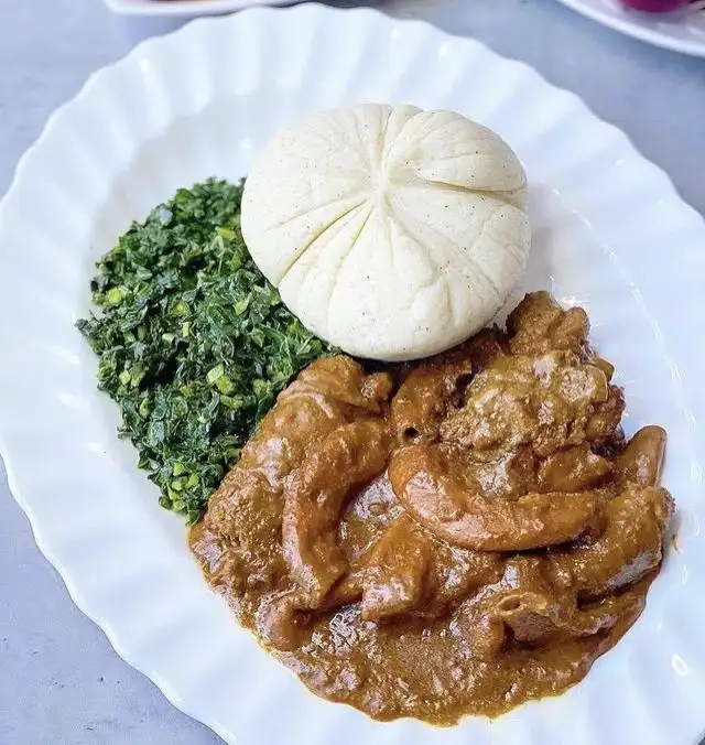 Sadza (White Ball of corn maize) with veggies and beef stew